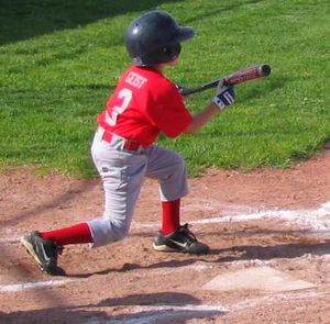 English: A Little League baseball player squar...