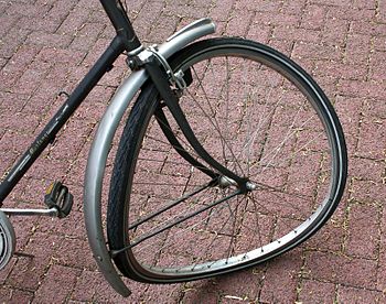 Torn front wheel of a bicycle after a crash wi...
